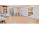 Open room with hardwood floors, neutral walls, bar stools and a wet bar in the background at 132 Copper Hills Dr, Canton, GA 30114