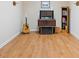 Room featuring hardwood floors, neutral walls, vintage stereo, guitar, and bookshelf at 132 Copper Hills Dr, Canton, GA 30114