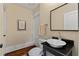Powder room featuring a vessel sink, black granite countertop, and modern fixtures at 1832 Gordon Ne Mnr, Atlanta, GA 30307