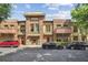 Charming townhome exterior with brick facade, wooden balconies, and well-manicured landscaping in a desirable community at 1832 Gordon Ne Mnr, Atlanta, GA 30307