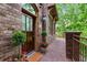Charming brick home featuring a wood front door, brick pathway, and lovely landscaping at 1832 Gordon Ne Mnr, Atlanta, GA 30307