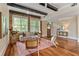 Well-lit living area features hardwood floors, exposed brick, and a contemporary design at 1832 Gordon Ne Mnr, Atlanta, GA 30307
