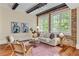 Cozy living room with hardwood floors, exposed brick, and ample natural light at 1832 Gordon Ne Mnr, Atlanta, GA 30307