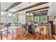 Spacious open-concept living and dining area with hardwood floors, exposed beams, and ample natural light at 1832 Gordon Ne Mnr, Atlanta, GA 30307