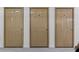 Three tan storage units with numbered doors, offering secure space for belongings at 1832 Gordon Ne Mnr, Atlanta, GA 30307