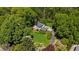 Ariel view of wooded property with a pool and well-maintained landscaping at 45 Michelle Ne Cir, Atlanta, GA 30342