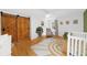 Bright bedroom features wood floors, stylish sliding barn doors, and a cozy reading nook with natural light at 45 Michelle Ne Cir, Atlanta, GA 30342
