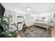 Cozy bedroom with wainscoting, natural light, a vintage rug, and a dedicated workspace at 45 Michelle Ne Cir, Atlanta, GA 30342