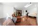Cozy bedroom featuring a stone fireplace, skylight and light hardwood floors at 45 Michelle Ne Cir, Atlanta, GA 30342