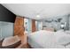 Bright bedroom features blue walls, light hardwood floors, and barn doors at 45 Michelle Ne Cir, Atlanta, GA 30342