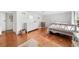 Bright bedroom featuring light hardwood floors and polka dot wallpaper at 45 Michelle Ne Cir, Atlanta, GA 30342