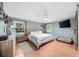 Bright bedroom features blue walls, hardwood floors, and large windows at 45 Michelle Ne Cir, Atlanta, GA 30342