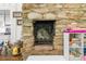 Stone fireplace with hearth and built in shelving at 45 Michelle Ne Cir, Atlanta, GA 30342