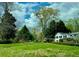 Well-maintained lawn and established greenery complement the classic white facade of this traditional home at 45 Michelle Ne Cir, Atlanta, GA 30342