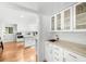 Bright kitchen with white cabinets, marble countertops, and modern hardware at 45 Michelle Ne Cir, Atlanta, GA 30342