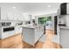 Bright kitchen with white cabinets, stainless steel appliances, granite countertops, and large window overlooking the backyard at 45 Michelle Ne Cir, Atlanta, GA 30342