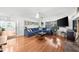 Bright and airy living room features a comfortable blue sectional sofa and natural light at 45 Michelle Ne Cir, Atlanta, GA 30342