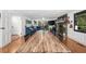 Open-concept living area adjacent to dining space, features a large window and stone fireplace at 45 Michelle Ne Cir, Atlanta, GA 30342
