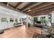Spacious living room with wood-beamed ceiling, lots of natural light, and light hardwood floors at 45 Michelle Ne Cir, Atlanta, GA 30342