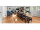 Open-concept space with a stone fireplace, blue sectional sofa, and large windows, creating a cozy atmosphere at 45 Michelle Ne Cir, Atlanta, GA 30342