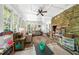 Bright living room with multiple windows, stone fireplace, and cozy seating at 45 Michelle Ne Cir, Atlanta, GA 30342
