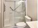 A bathroom featuring a walk-in shower with grab bars, a toilet, and a sink with modern fixtures at 475 Mount Vernon Ne Hwy # 129C, Atlanta, GA 30328