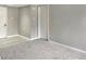 Spacious carpeted room has multiple electrical outlets and a large door to an additional room at 475 Mount Vernon Ne Hwy # 129C, Atlanta, GA 30328