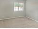 Cozy bedroom features soft carpeting and a large window letting in plenty of natural light at 475 Mount Vernon Ne Hwy # 129C, Atlanta, GA 30328