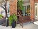 Building entrance featuring a convenient bench, greenery, and wheelchair access for added accessibility at 475 Mount Vernon Ne Hwy # 129C, Atlanta, GA 30328
