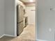 An updated kitchen with modern appliances, light gray cabinets, butcher block counters, and stylish flooring at 475 Mount Vernon Ne Hwy # 129C, Atlanta, GA 30328