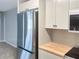 An updated kitchen with modern appliances including a stainless steel refrigerator, microwave, and stove at 475 Mount Vernon Ne Hwy # 129C, Atlanta, GA 30328