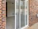 Living room view with glass sliding door leading to an outdoor patio area at 475 Mount Vernon Ne Hwy # 129C, Atlanta, GA 30328