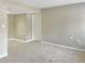 Spacious living room with plush carpet and neutral paint at 475 Mount Vernon Ne Hwy # 129C, Atlanta, GA 30328
