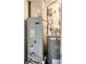 Utility room featuring a Rheem water heater and Carrier air conditioner at 475 Mount Vernon Ne Hwy # 129C, Atlanta, GA 30328
