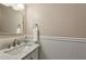 Elegant bathroom featuring a marble countertop and a towel ring with a white towel at 6906 Park Ave, Atlanta, GA 30342