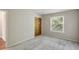 An inviting bedroom with neutral carpeting and a window that provides natural light at 6906 Park Ave, Atlanta, GA 30342