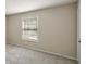 A bright bedroom with neutral carpeting and a window that provides natural light at 6906 Park Ave, Atlanta, GA 30342