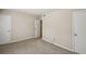 This spacious bedroom features neutral walls, gray carpet, and two closets for ample storage at 6906 Park Ave, Atlanta, GA 30342