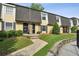 Charming townhouse featuring a well-manicured lawn and a welcoming walkway to the front door at 6906 Park Ave, Atlanta, GA 30342