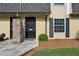 Close up of townhouse doors and brick accent columns with fresh landscaping and dark shutters at 6906 Park Ave, Atlanta, GA 30342
