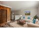Welcoming living space featuring hardwood style floors, custom built-ins, and comfortable seating at 6906 Park Ave, Atlanta, GA 30342