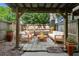 Charming covered patio with comfortable seating and a view of the fenced backyard at 6906 Park Ave, Atlanta, GA 30342