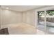 View of the patio with tiled floor and sliding glass doors to the backyard at 6906 Park Ave, Atlanta, GA 30342