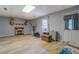 Finished basement featuring faux fireplace, exercise equipment, tile floors and ample storage at 75 Puppy Chase, Social Circle, GA 30025