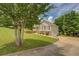 Inviting home with well-manicured lawn, mature trees, and a charming facade, perfect for suburban living at 75 Puppy Chase, Social Circle, GA 30025