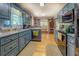 Cozy eat-in kitchen with blue cabinets, hardwood floors, and stainless steel appliances at 75 Puppy Chase, Social Circle, GA 30025