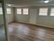 Finished basement with wood-look flooring, multiple windows, and ample natural light at 8922 Gatewood Cir, Jonesboro, GA 30238