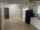 Functional kitchen featuring essential appliances, tiled floors, and ample space for dining at 8922 Gatewood Cir, Jonesboro, GA 30238