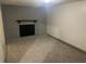 Cozy living area featuring a stone fireplace, neutral carpeting, and a warm ambiance at 8922 Gatewood Cir, Jonesboro, GA 30238