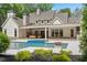 Exterior backyard view showcases the in-ground pool, patio area, and lush landscaping for outdoor enjoyment at 1084 Wrights Mill Rd, Canton, GA 30115